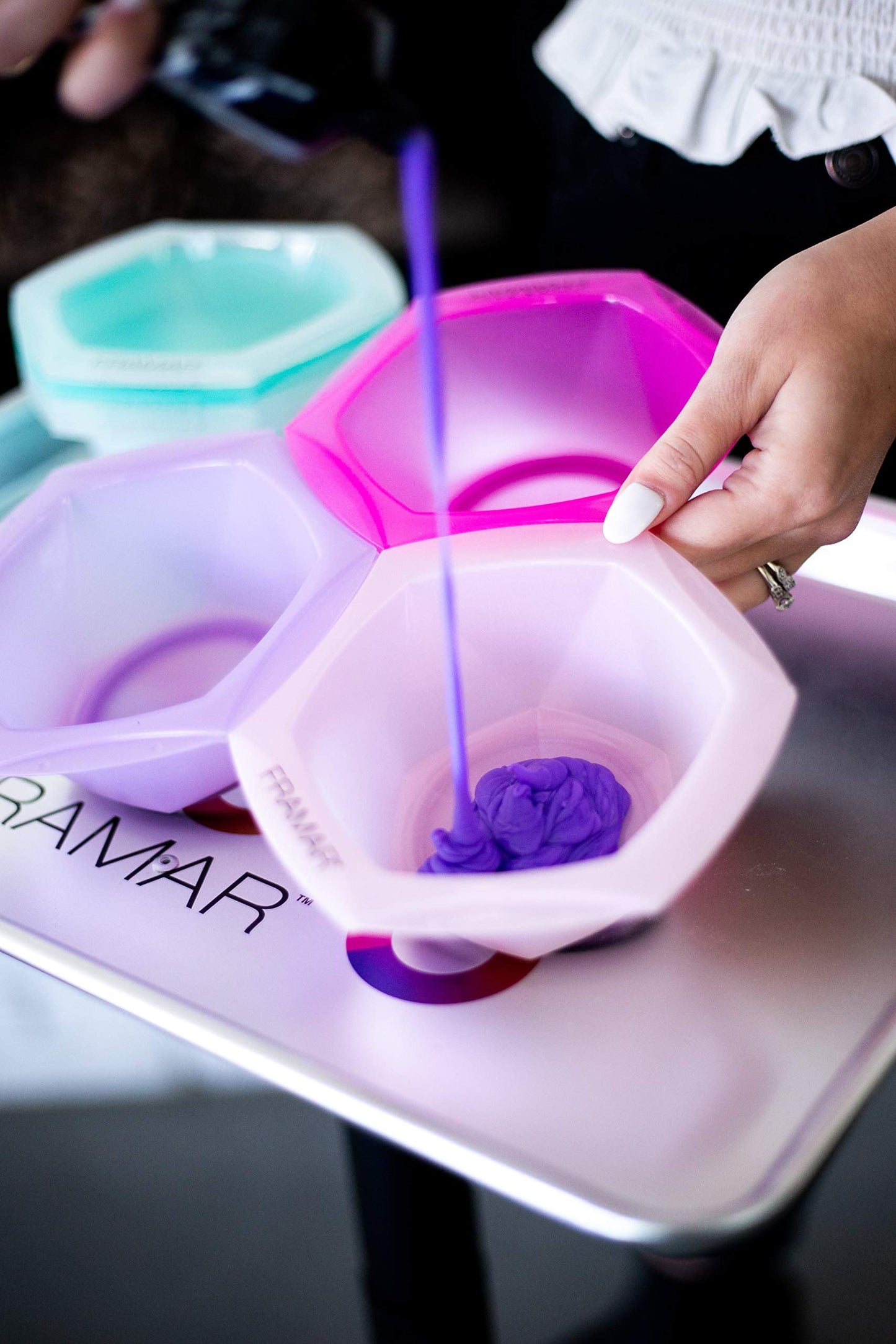 Seven distinct vibrant color bowls from the FRAMAR connect and color set spread out