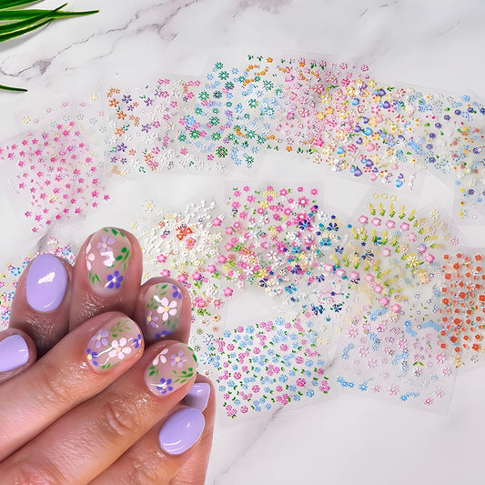 Close up view of 3D daisy and heart nail art decals