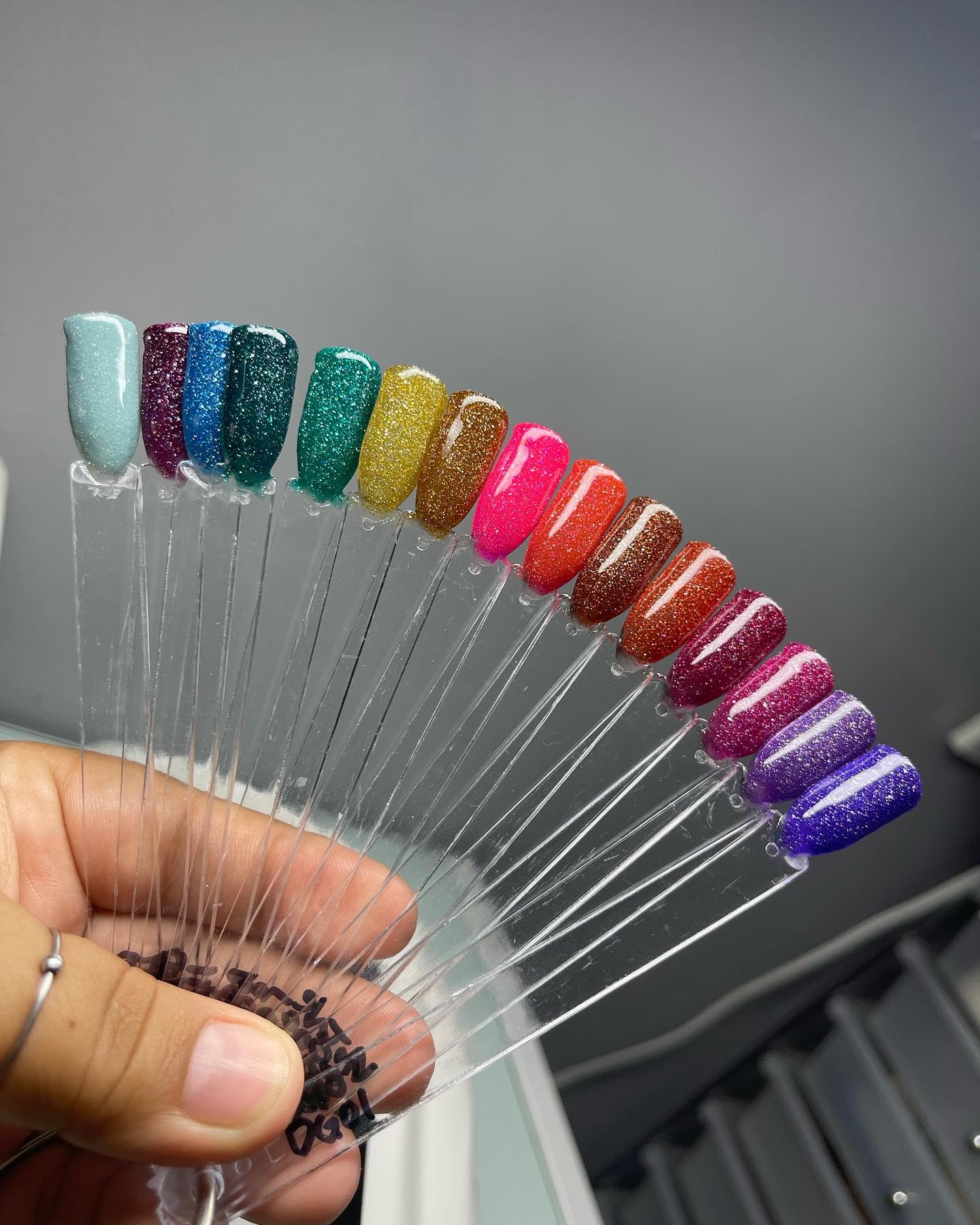 Detailed view of Hedume nail swatch kit components