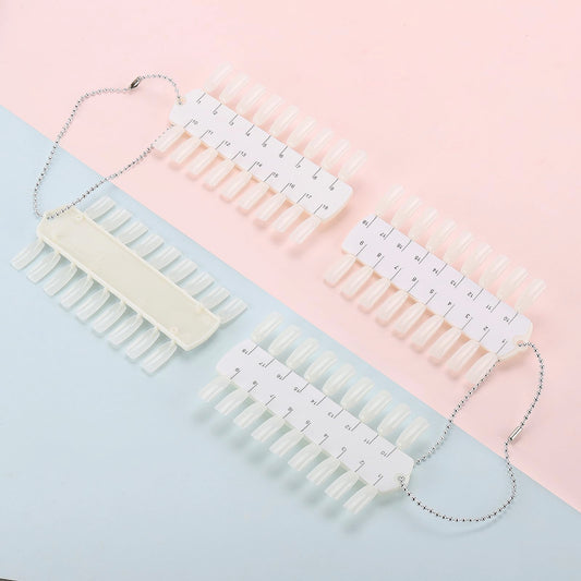 Clear plastic nail polish display tips on metal chain