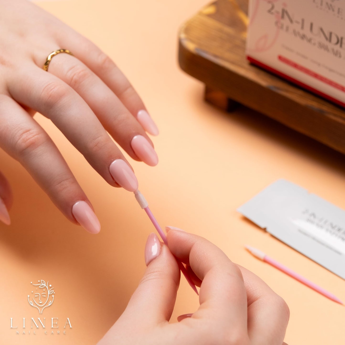 Linnea nail cleaning tool being held to show the dual-ended design.