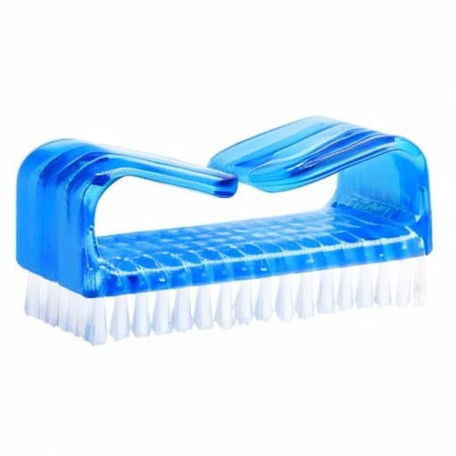 A person using the Hupos manicure cleaning brush to scrub dirt from under fingernails.