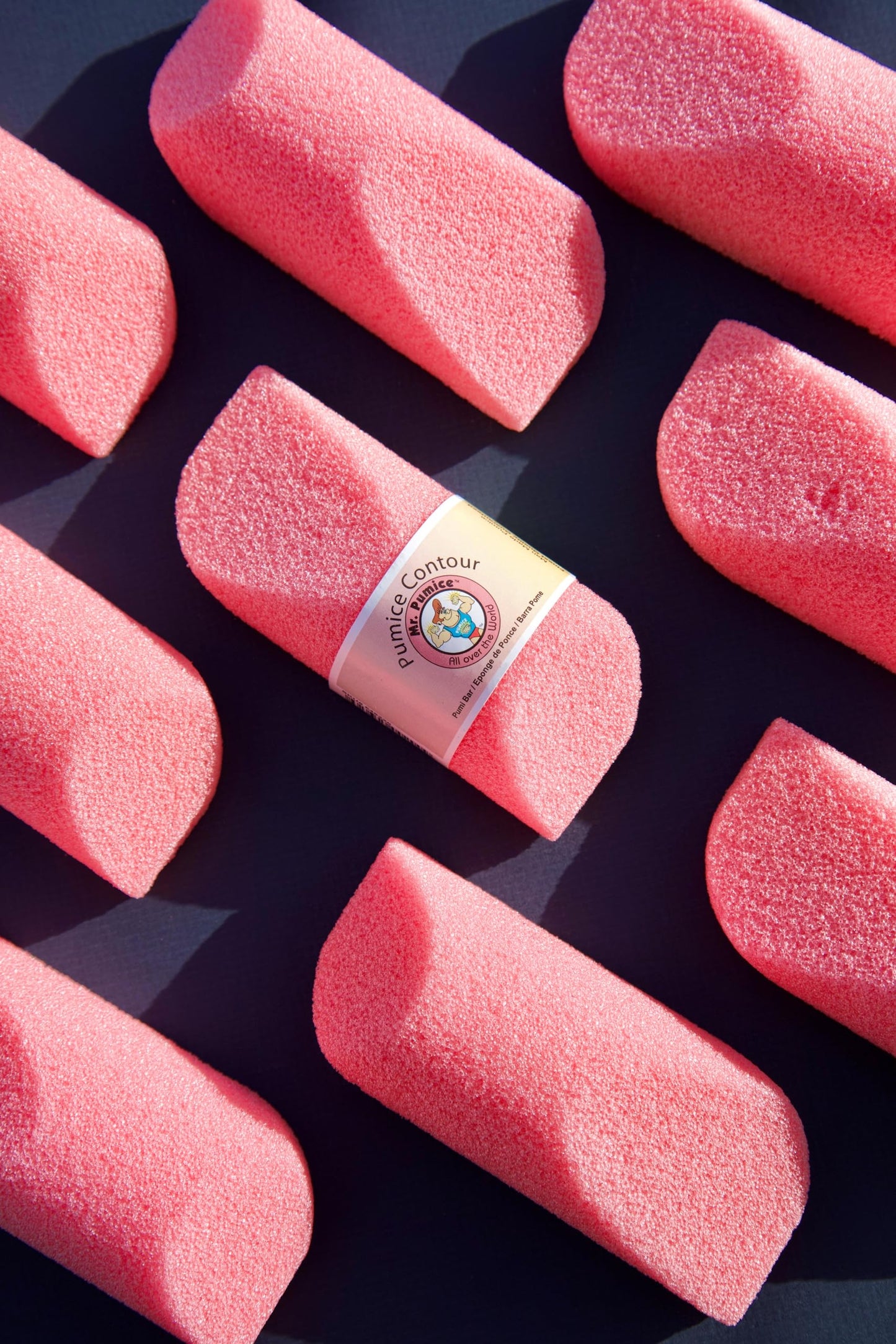 Using Mr. Pumice Pink Contour Bar on hand for smoothing
