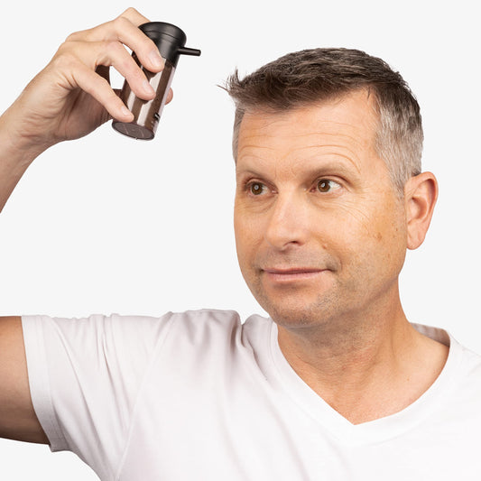 Caboki hair loss concealer box showing built-in atomizer spray pump applicator
