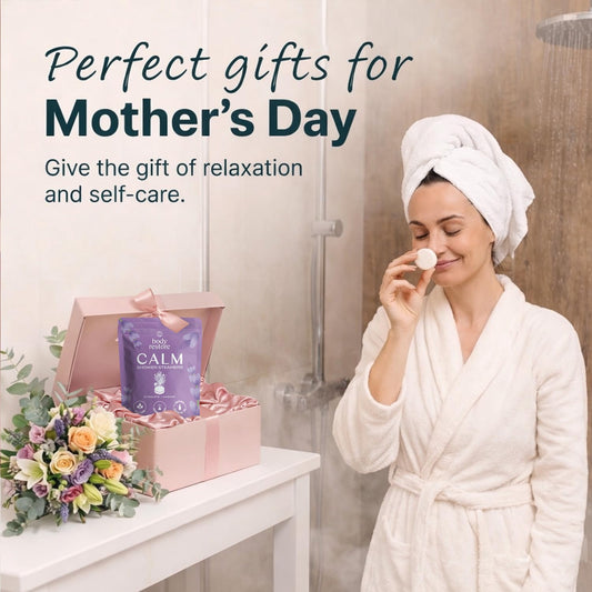 Body Restore calming aromatherapy tablet dissolving on a modern shower floor