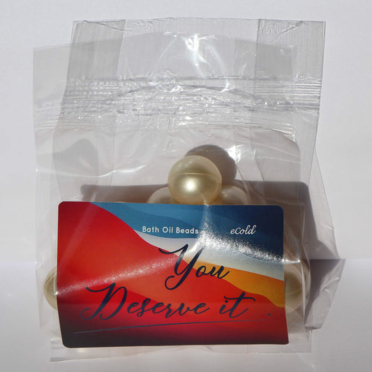 Ivory white retro bath pearls dissolving in warm running water for skin hydration