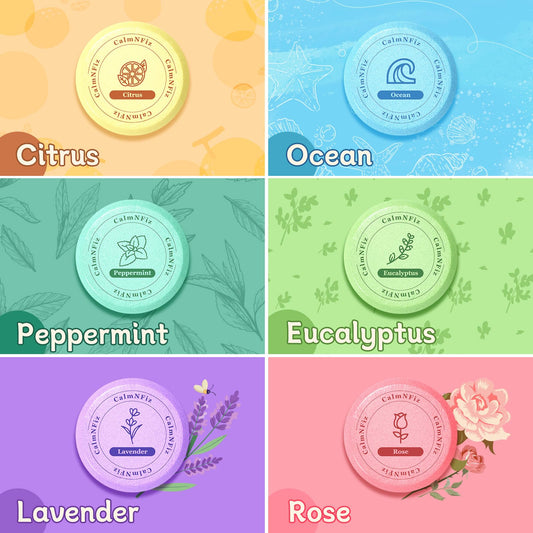 Six individual essential oil shower tablets unpacked showing different color variants