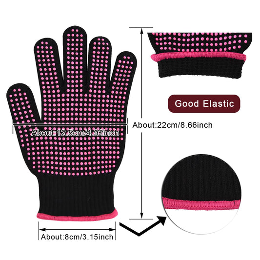 A pair of stretchable black styling gloves with pink heat blocking silicone nodules placed on a flat surface.