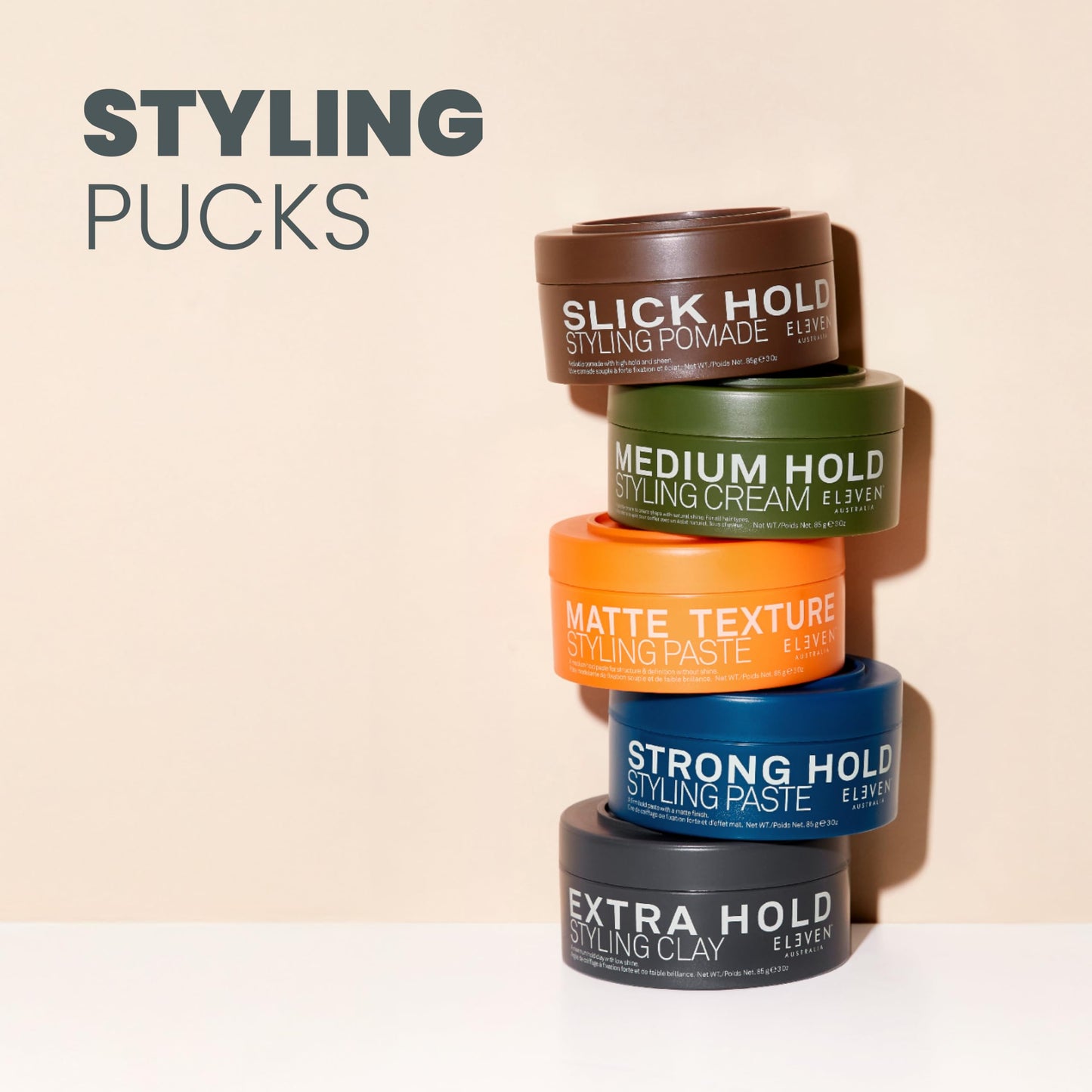 Open jar of Eleven Australia maximum hold clay showcasing the smooth styling product inside