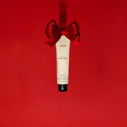 JVN hair smoothing cream texture squeezed out showing the lightweight styling formula.