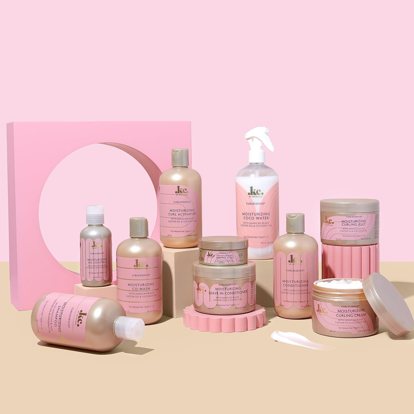 KeraCare curly hair refresher spray being held to showcase the sixteen ounce product size