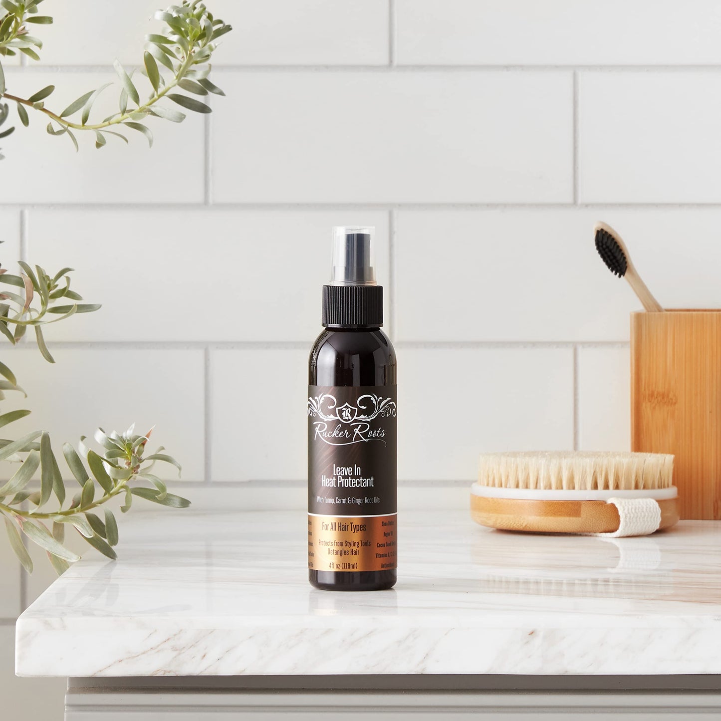 Rucker Roots professional leave-in conditioning heat protectant spray on a minimalist lifestyle background.