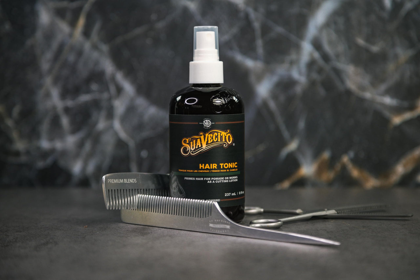 Suavecito hair tonic mist bottle detailing the premium packaging design
