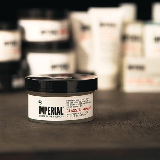 Imperial Barber Classic Pomade water based styling wax texture inside the open six ounce container.