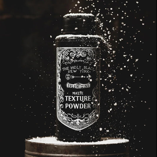 The Holy Black matte hair styling powder packaging.