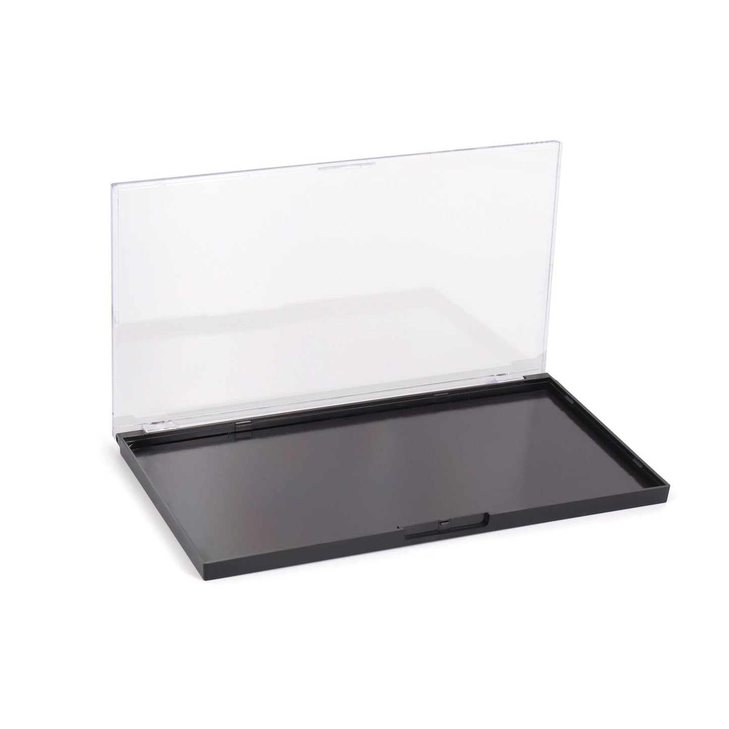 Professional makeup artist organizing cosmetics in magnetic palette
