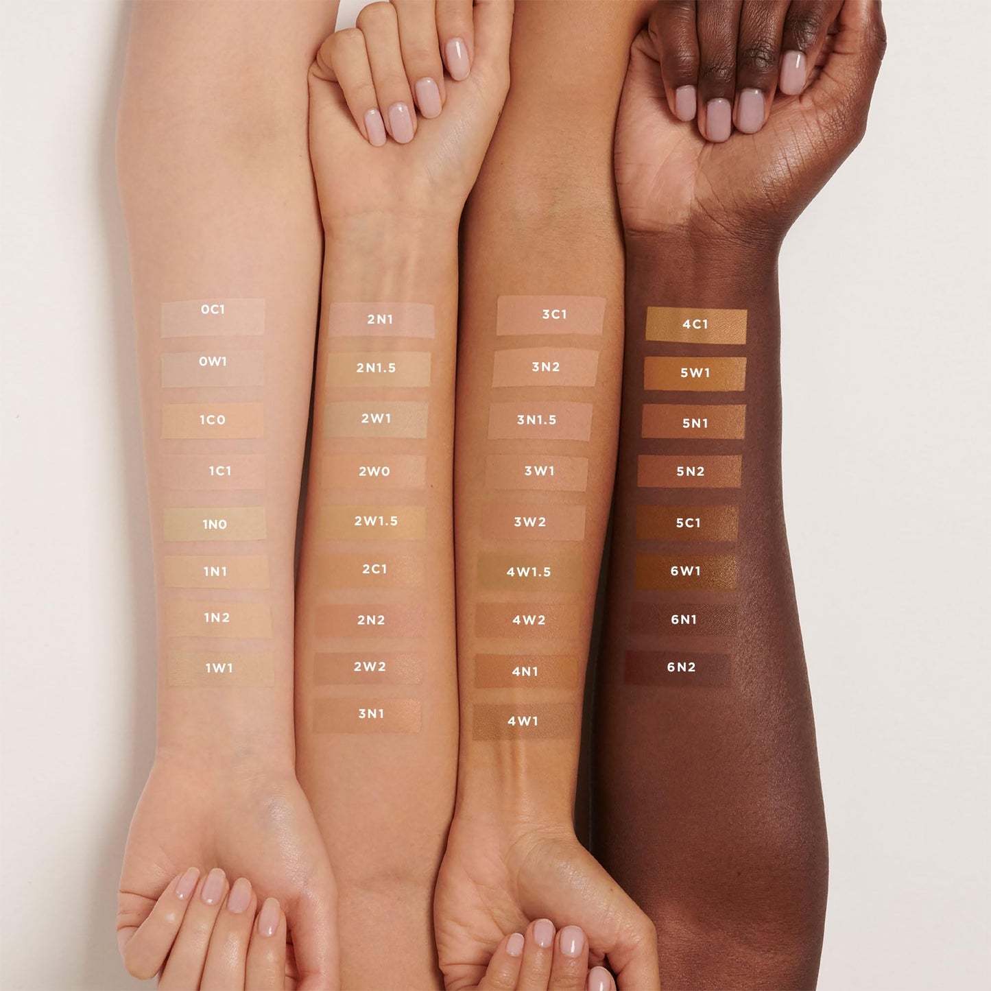 Authentic Laura Mercier luminous finish foundation bottle angled to display the clear product branding and text.