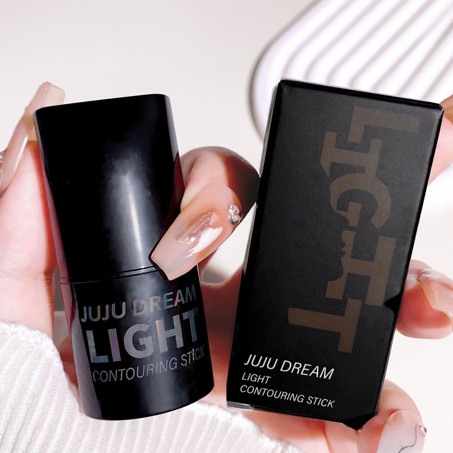 Milk Makeup cream sculpting stick showing close-up texture details.