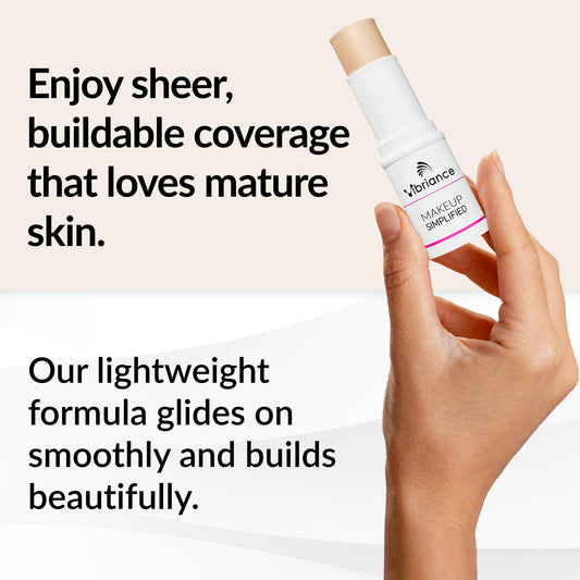 Hydrating cream foundation stick being applied to mature skin to blur fine lines and wrinkles.