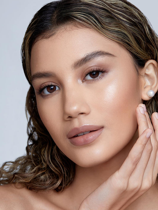 SHEGLAM cream highlighter stick cap off showcasing the luminous Vanilla Frost shade