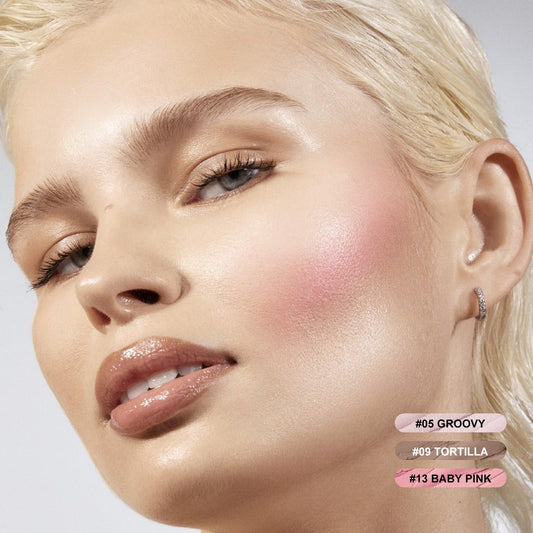 Open makeup pens showing the cream contour blush and highlighter shades side by side