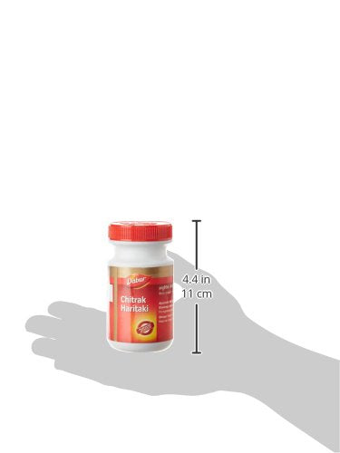 Close up of the texture of Dabur Chitrak Haritaki Ayurvedic paste alongside its packaging.