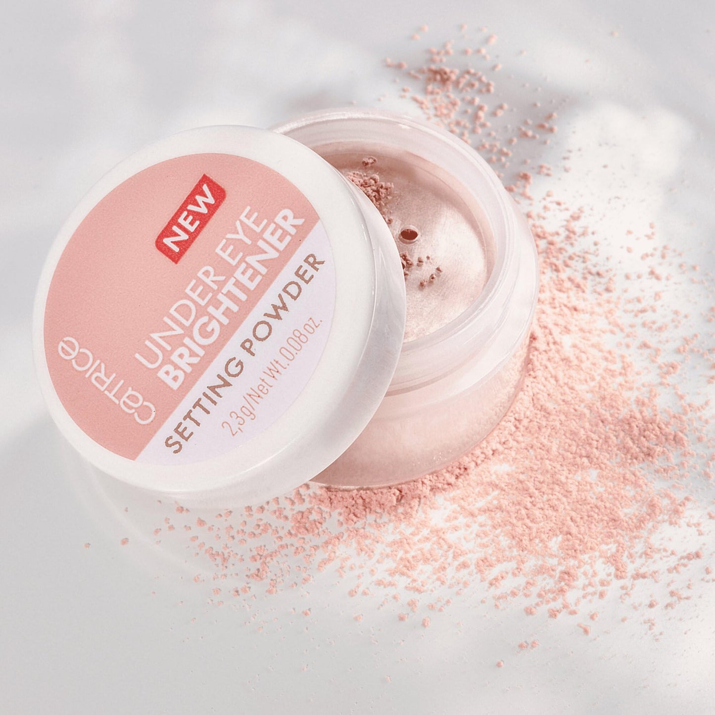 Catrice under eye powder being applied with a makeup brush for a creaseless finish
