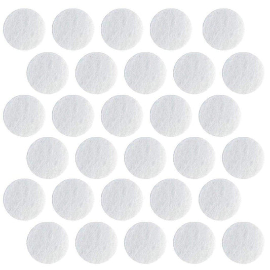 Close up view of the 150 grit D14.5 microdermabrasion replacement tips alongside 11mm cotton machine filters.