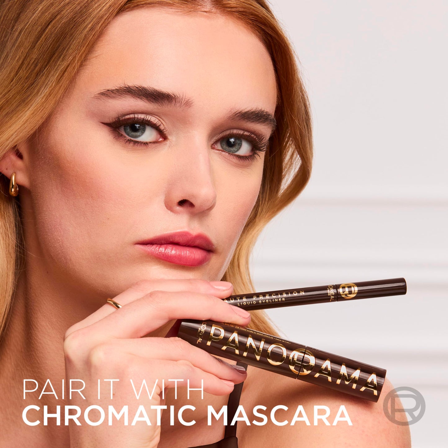 Full collection view of the imported L'Oreal Paris liquid eyeliner pen with cap off ready for application.