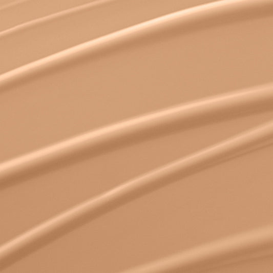 Lancome liquid foundation bottle showing the clear product shade and white cap closure