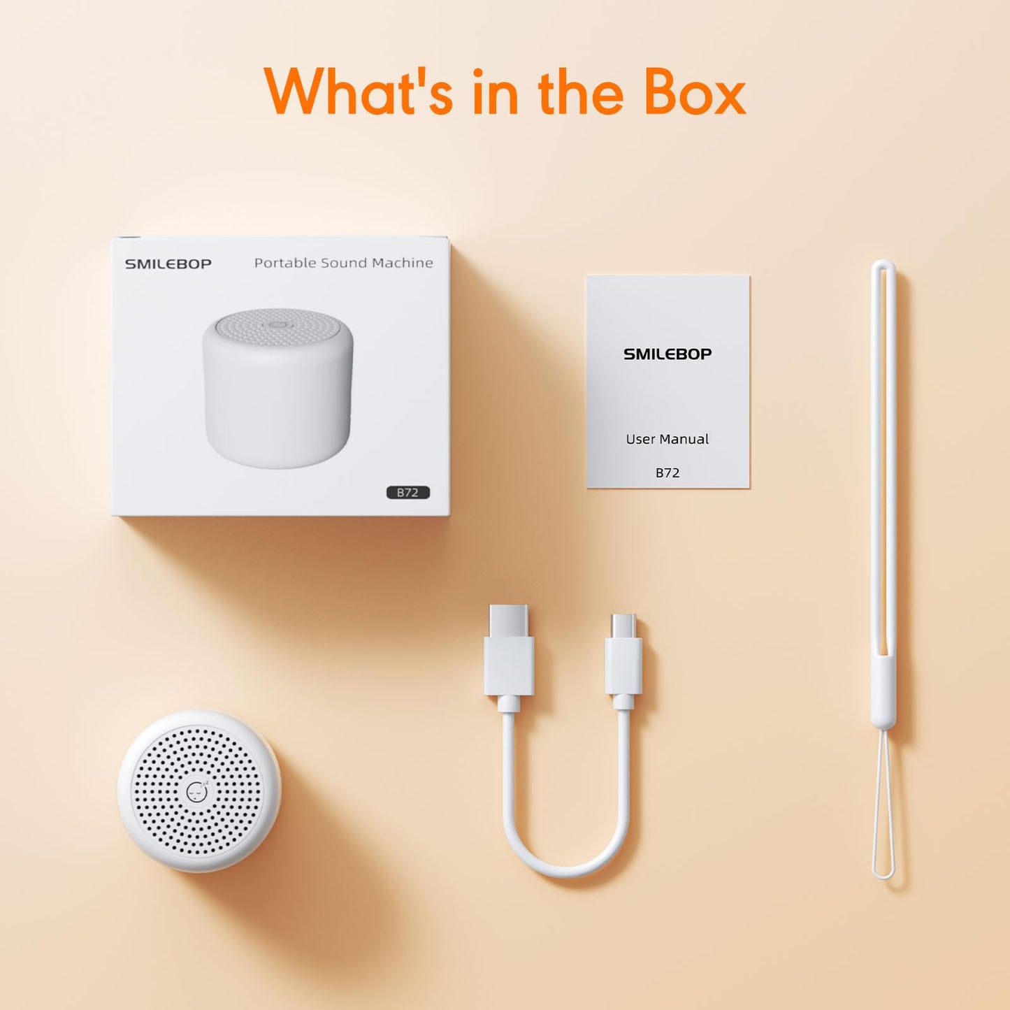 SMILEBOP miniature white noise machine held in an adult hand
