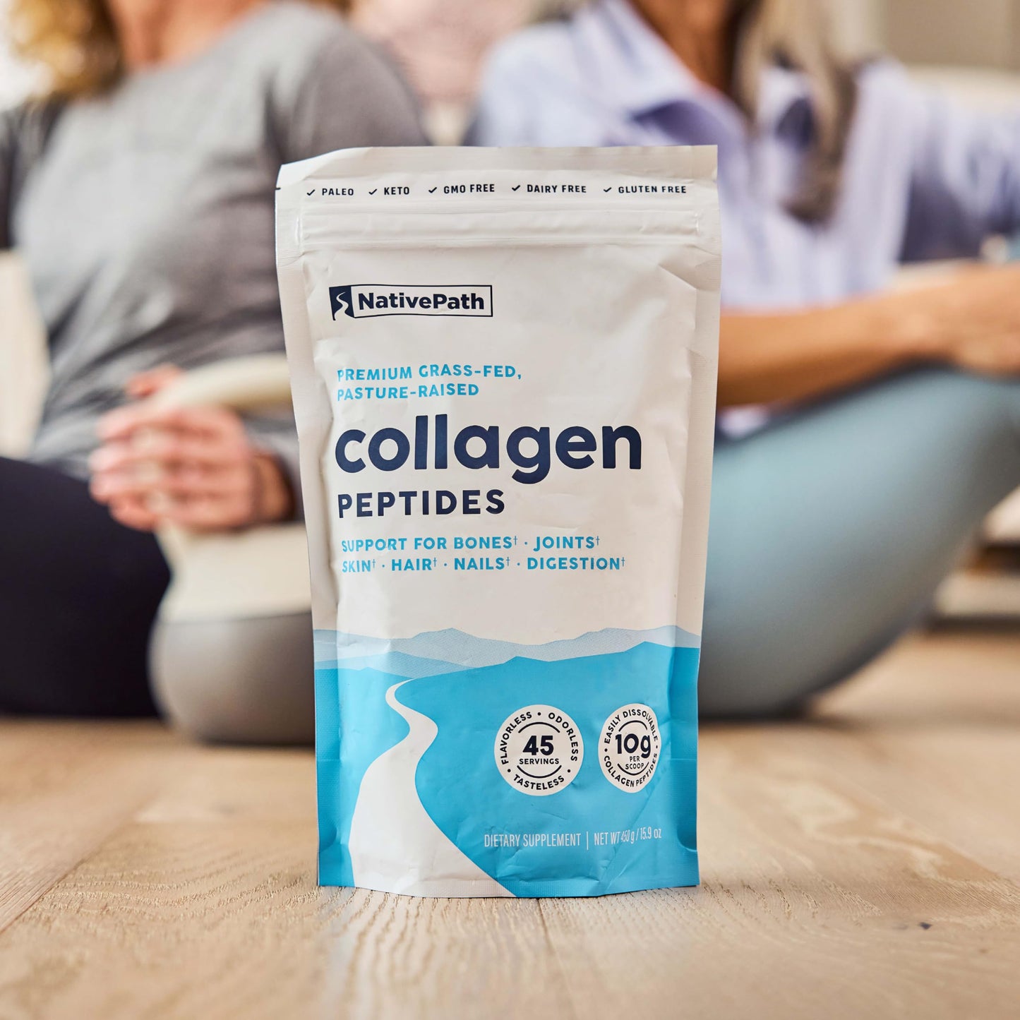 Fine texture of hydrolyzed NativePath Type 1 and 3 collagen protein powder on a wooden spoon