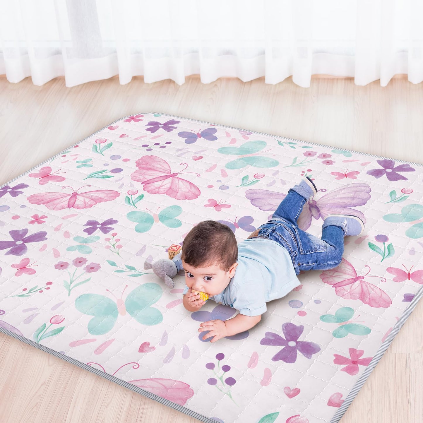 Infant playing on large Funtery boho butterfly mat