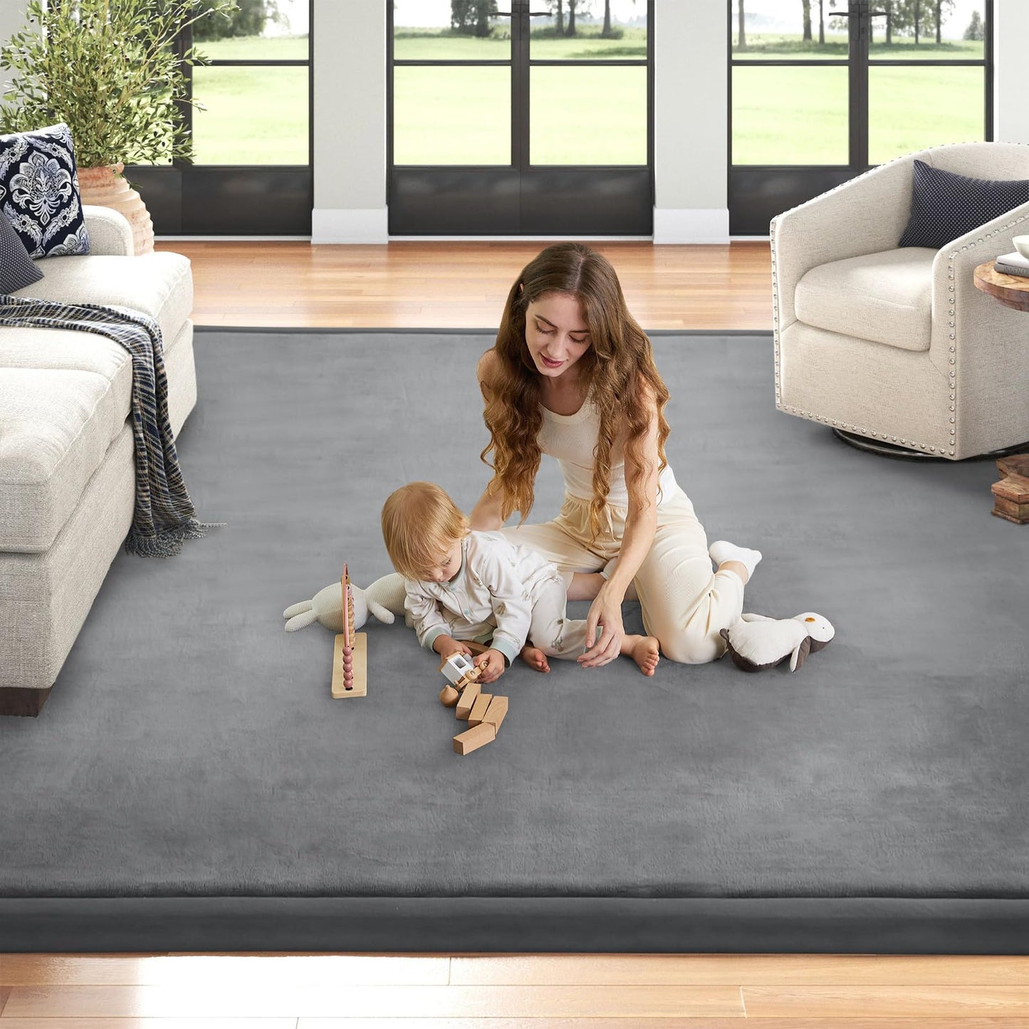Child playing on ILPEOD memory foam area rug