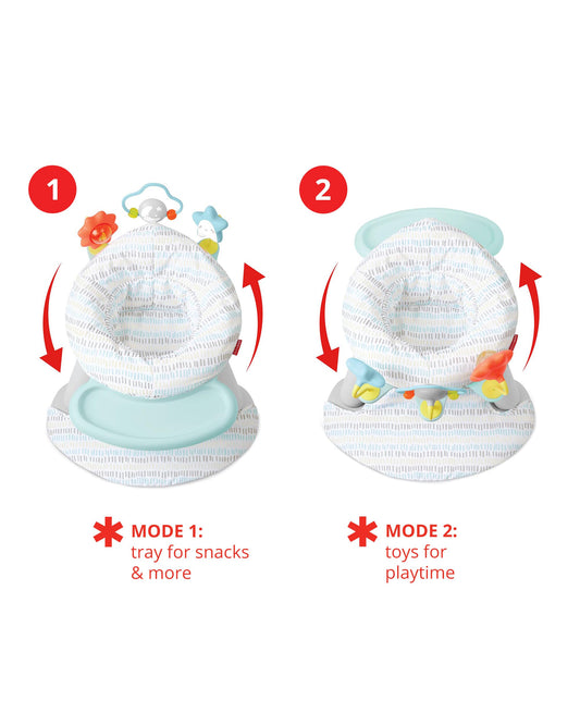 Baby using Skip Hop 2-in-1 floor seat with interactive toys