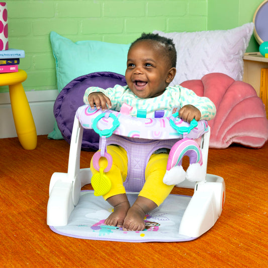 Bright Starts baby floor seat with rainbow toy and Taggies