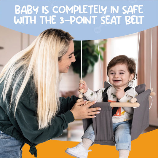 Side angle of wooden baby swing with safety harness