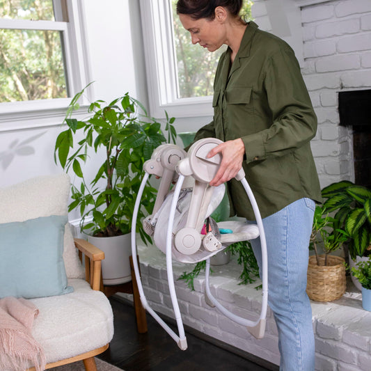 Ingenuity Cozy Kingdom baby swing side profile showing recline