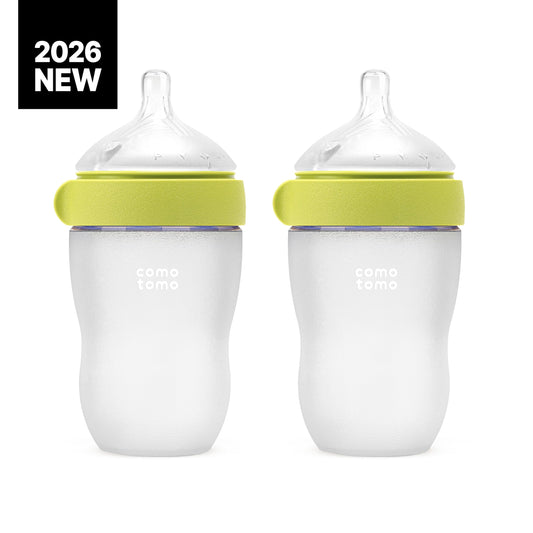 Close up view of the soft breast like medical grade silicone nipple on the green Comotomo bottle.