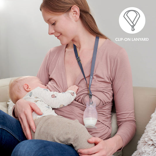 Medela milk collector with suction base on a flat surface