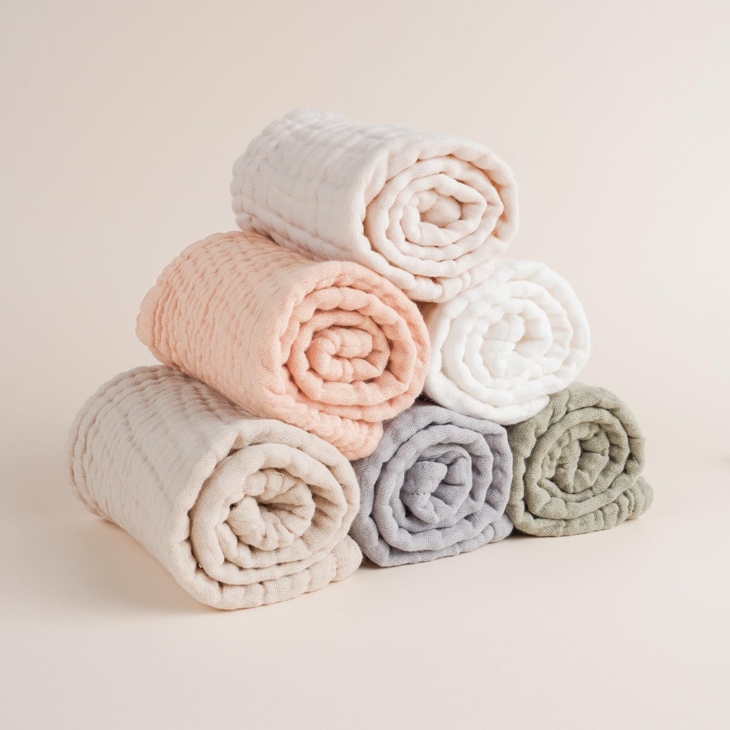 Soft absorbent muslin burp cloth being used as a washcloth