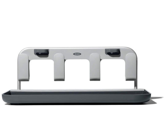 Oxo bottle drying rack holding four water bottles and lids