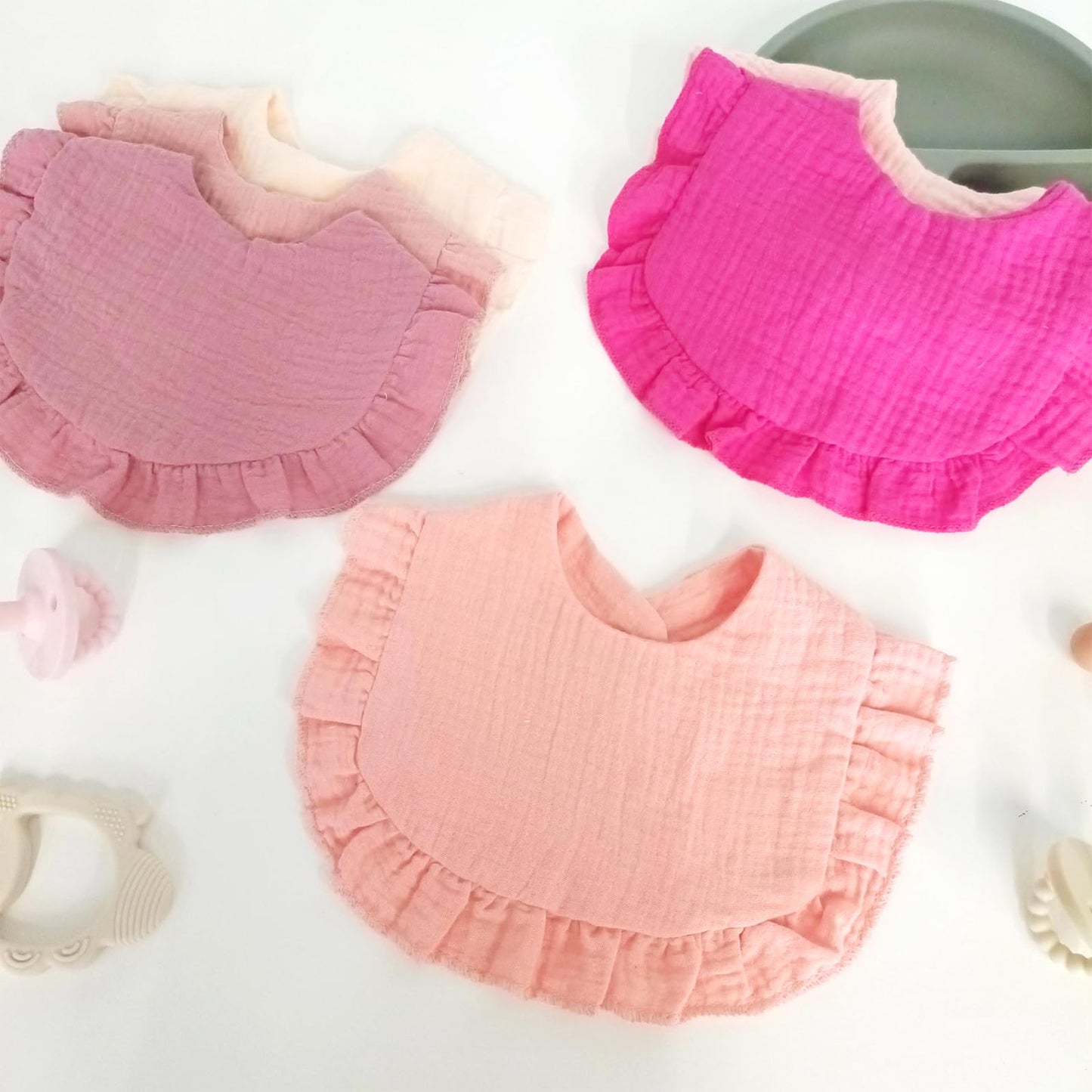 Baby wearing soft muslin bandana bib for teething