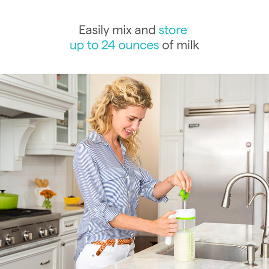 Munchkin baby formula blender pitcher showing the rotating handle and integrated mixing paddle.