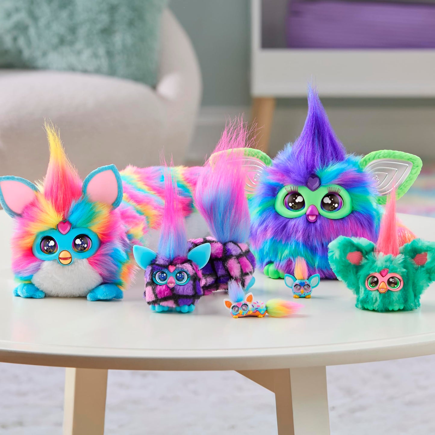 Product packaging for the USA imported Furby DJ Furblets Berry-Cup-Cake electronic toy with included batteries