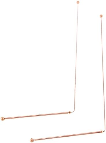 Close up of pure copper dowsing rods with ball ends