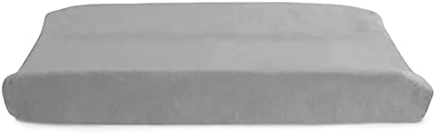 Side view angle of the curved contour edges on a premium grey infant diapering pad.