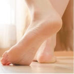 Close up of Ever Ready footcare tool removing corns from feet