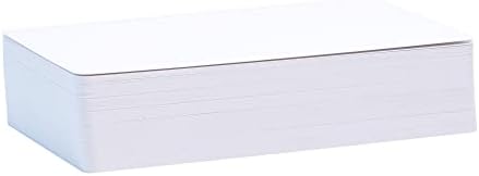 Hand holding blank tarot card showing glossy and matte finish