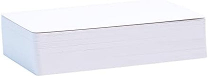 Hand holding blank tarot card showing glossy and matte finish